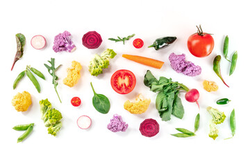 Fresh vegetables overhead flat lay composition on a white background. A variety of healthy vegan salad ingredients