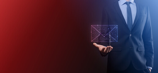 Businessman hand holding e-mail icon, Contact us by newsletter email and protect your personal information from spam mail. Customer service call center contact us concept