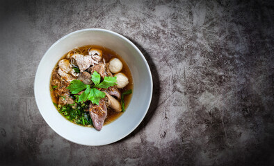 THAI BOAT NOODLE SOUP or KUAYTIAW REUA This delicious Thai noodle soup Local food in Thailand that can be eaten in general is delicious and cheap, Braised pork noodles,Thai food with copy space