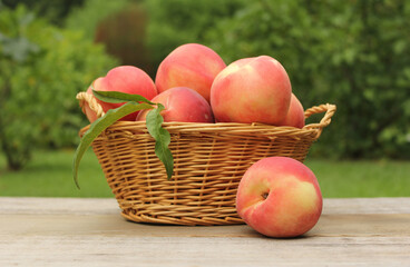Basket of Fresh Organic Peaches on table at Market