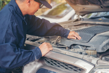 Mechanic car service auto garage in automotive mobile center. Technician workshop repair engine motor vehicles service mechanical engineering business. Automobile mechanic hands car repairs technic