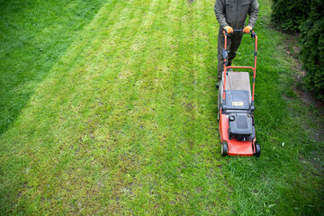 Lawn mover on green grass. Machine for cutting lawns.