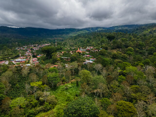 Obraz premium Beautiful aerial view of the Aquiares town and its iconic yellow church in Cartago Costa Rica