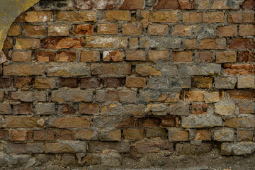 Brick wall texture, loft style, destruction of concrete and stone, antiquity corrosion, foundations of building floors, chips, cracks