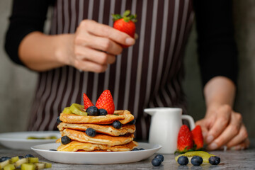 Woman preparing pancakes