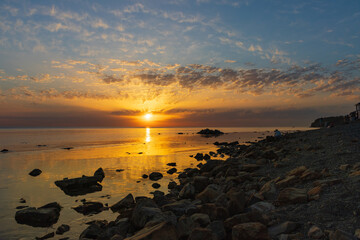 Sunrise over the sea and beautiful cloudscape in Anapa