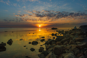 Fototapeta na wymiar Sunrise over the sea and beautiful cloudscape in Anapa