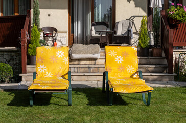 Two loungers in the garden in front of the terrace