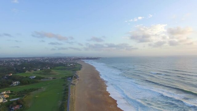 Aerial view of sunsets over the sea. Beautiful waves. Beautiful sea. Summer sunset seascape. Sunsets on the beach of the Atlantic Ocean. Texture of the water. Top view of the fantastic natural sunset.