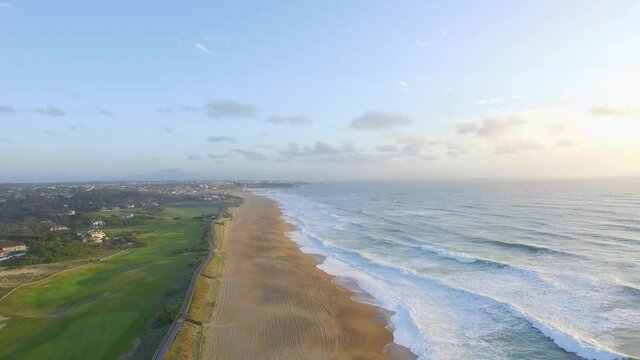 Aerial view of sunsets over the sea. Beautiful waves. Beautiful sea. Summer sunset seascape. Sunsets on the beach of the Atlantic Ocean. Texture of the water. Top view of the fantastic natural sunset.