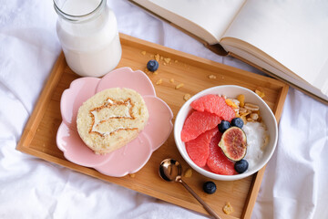 Light and delicious healthy meal / Grapefruit Muesli Bowl and Milk / Pampered yourself having breakfast in bed