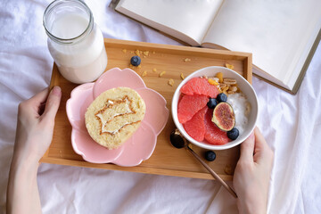 Light and delicious healthy meal / Grapefruit Muesli Bowl and Milk / Pampered yourself having breakfast in bed