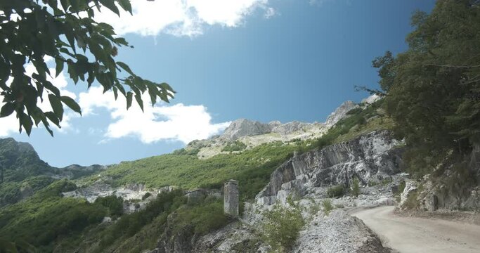 White road leading to the marble quarries of the Apuan Alps.The Apuan mountains between the Foce di Giovo and the Passo delle Pecore in Orto di Donna. Apuan Alps, Tuscany, Italy. 