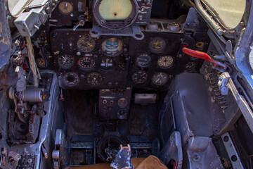 Instruments in the cockpit of an old fighter jet. Old fighter dashboard