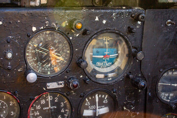Instruments in the cockpit of an old fighter jet. Old fighter dashboard