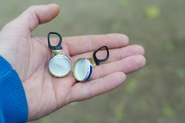 Hand and  ring pull beer caps.