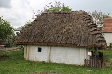 Fototapeta na wymiar Strawy small house of vernacular architecture in Borsky Mikulas, west Slovakia