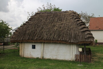 Fototapeta na wymiar Strawy small house of vernacular architecture in Borsky Mikulas, west Slovakia