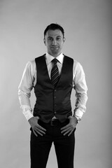 Black and white portrait of a man in waistcoat