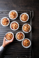 homemade muffins on a baking rack on a wooden background. place for your text, flat lay background. place for your text, flat lay