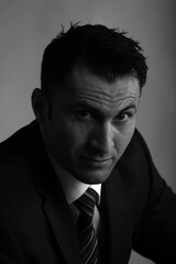 Black and white portrait of a man in jacket