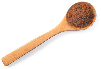 brown sugar in the wooden spoon, isolated on white background, top view
