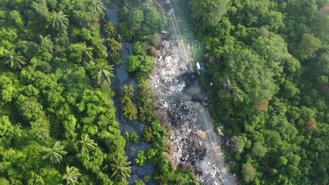 Aerial view open burn plastic and waste from household