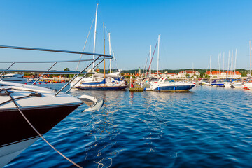 Sailing yachts moored on a pier in a harbour on baltic sea in a sunny morning