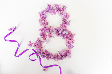 Creative greeting card background banner for March 8, with lilac flowers and ribbons on a white background, International Women's Day