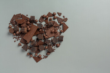 Chocolate on the dark background. World Chocolate Day concept