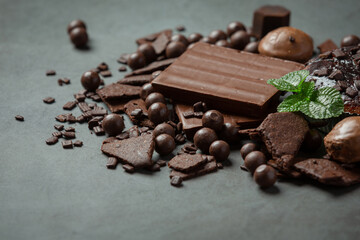 Chocolate on the dark background. World Chocolate Day concept