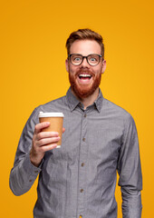 Excited bearded man with takeaway coffee