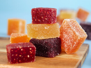 A colorful traditional French fruit jellies (Pâte de fruits). It's a sweet dessert which is main ingredients are concentrate fruits paste, sugar and pectin surrounding with sugar crystal 