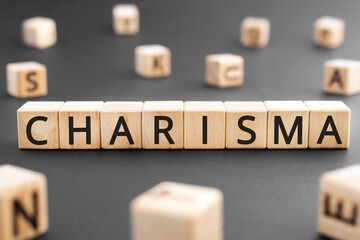 Charisma - word from wooden blocks with letters, Charisma concept, random letters around black...