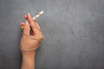Human hand holding cigarette.World no Tobacco day concept.