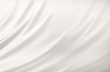 Obraz premium Smooth elegant white silk or satin luxury cloth texture can use as wedding background. Luxurious background design. White silver fabric silk background with beautiful soft blur pattern natural.