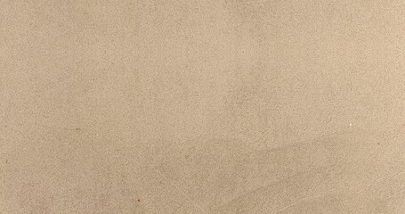 Obraz premium Panorama of Light brown fine-grained sand on the beach texture and background seamless