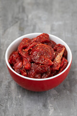 marinated raw meat with spices in red and white bowl