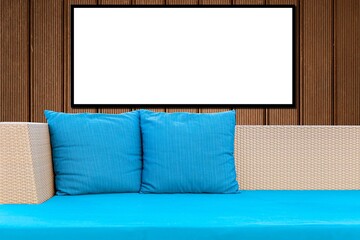 Blank frames and sofa designs with blue cushions and pillows in a modern home living room