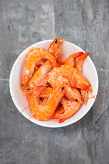 boiled gresh tasty shrimps in small white bowl