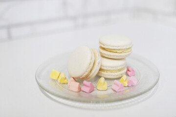 French colored dessert macaron close-up in a plate