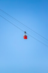 Barcelona in movement cablecar picture taked in a sunny day with a beautiful blue clear sky.