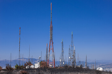cellular network mobile network  wireless radio system on top of a dry rocky hill above Athens