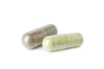 Herbal powder capsules isolated on white background