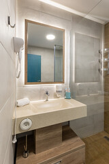 Interior of a luxury hotel bathroom with glass shower cabin