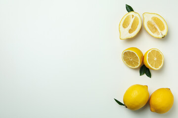 Ripe lemons on white background, space for text