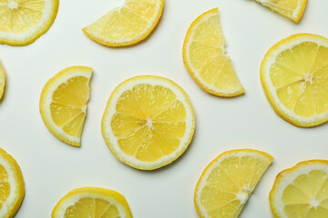Ripe lemon slices on white background, top view