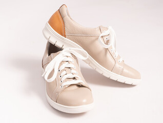 Comfortable sneakers made of beige genuine leather