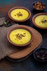 mango-flavored Phirni served in earthen plate 