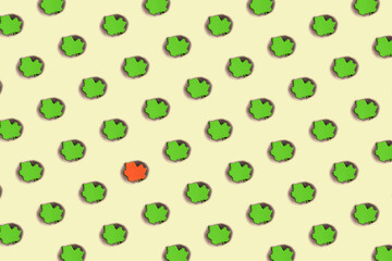 Colorful minimal pattern made of burnt spot on color paper in green and yellow